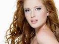 Beautiful red-haired woman with long  wavy hairs