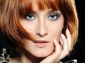 Beautiful red haired woman with fashion bob hairstyle and creative trendy make-up