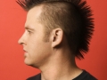 Caucasian man with mohawk.