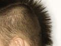 Caucasian man with mohawk.