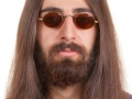Long-haired hippie man in a glasses