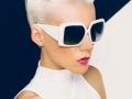 Blonde model in trendy sunglasses with stylish Haircut. Fashion photo