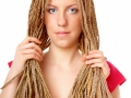 Beautiful girl many plaits hairstyle holding hairs